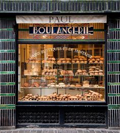 a bakery with lots of baked goods in the window