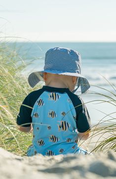 A fun print enlivens this one-piece swimsuit made fashioned with short sleeves and UPF 50+ sun protection so your kiddo stays safe under the rays. UPF 50+ sun protection 82% polyester, 18% elastane Machine wash, line dry Imported Upf 50+ Swimwear For Ocean Activities, Upf 50+ Beachwear For Ocean Activities, Upf 50+ Swimwear For Ocean Beachwear, Playful Swimwear With Upf 50+ For Ocean Activities, Playful Summer Swimwear For Ocean Activities, Playful Swimwear For Ocean Activities In Summer, Playful Summer Swimwear For Beach Activities, Playful Blue Rash Guard For Pool, Playful Swim Trunks With Uv Protection For Pool