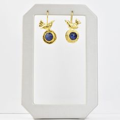 Handmade in Turkey Gold plated over brass Bezel set ruby or lapis Earrings measure about 1.25" long French ear wire with hook closure Click HERE to see more jewelry from AJS Design Goldmakers Jewelry Mission Statement Goldmakers Jewelry creates and curates a comprehensive selection of artfully designed hand-crafted jewelry. We aspire to offer the jewelry enthusiast access to affordable classics as well as fresh innovative designs. Lapis Earrings, Artfully Designed, Bird Earrings, Mission Statement, Crafted Jewelry, Free Gift Wrapping, Ear Wire, Bezel Setting, Innovation Design