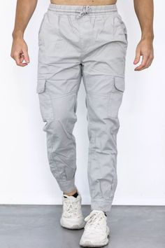 The men's trousers combine perfect functionality with a sovereign military style. The robust cotton twill material will go a long way and is comfy to wear. The pants offer two patched cargo pockets with flaps and metallic press studs as well as side and back pockets. A perfect fit and wearing comfort is provided by the elastic waistband with knotted drawstrings. Furthermore, the cuffs are adjustable via Velcro fasteners. A dividing seam above the knee gives the functional military trousers additional structure. Gray Cotton Pants For Outdoor, Gray Cotton Outdoor Pants, Gray Cotton Cargo Pants For Outdoor, Gray Cotton Parachute Pants For Outdoor, Outdoor Gray Cotton Cargo Pants, Gray Tapered Leg Cotton Cargo Pants, Gray Cotton Tapered Leg Cargo Pants, Gray Tapered Leg Cargo Pants In Cotton, Gray Cotton Utility Cargo Pants