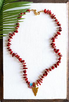 Please note that as this item is made to order it will take about 3-5 days before the item ships. Cacique Taino inspired necklace. Hand sewn using Miyuki Delica seed beads and coral chip beads.  The finished length of the necklace is 18" with gold lobster clasp finish.  This Puerto Rican necklace inspired by Taino caciques is a stunning piece of jewelry that pays homage to the rich cultural heritage of the island's indigenous people. Each necklace features carefully selected coral chip stones, which are reminiscent of the materials traditionally used by Taino chieftains. These coral chips, often in shades of vibrant red and soft pink, are meticulously strung together to form a captivating and earthy design. The necklace embodies the spirit of the Taino caciques, symbolizing their connectio Red Bohemian Necklace With Lobster Clasp, Bohemian Red Necklace With Lobster Clasp, Bohemian Red Pendant Crystal Necklace, Bohemian Red Crystal Pendant Necklace, Red Bohemian Pendant Crystal Necklace, Red Bohemian Beaded Necklace With Lobster Clasp, Bohemian Red Turquoise Single Strand Necklace, Handmade Red Necklaces For Meditation, Handmade Red Necklace For Meditation