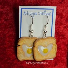 Egg in Toast Earrings Toast slices measure approximately between 1.5cm to 2.25cm Materials: ▫ Polymer Clay ▫ Hypoallergenic Hanging Earring Hook Each Toast is handmade by me, so you may receive a pair of earrings that are slightly different from the ones pictured in the listing. As they are all made by hand all are similar but no two pairs will ever be the same! I can also do custom orders. Please feel free to send me a message with any questions or ideas! Thanks for checking out my shop! Novelty Everyday Dangle Earrings, Everyday Novelty Dangle Earrings, Novelty Dangle Earrings For Everyday, Everyday Nickel-free Resin Jewelry, Novelty Hypoallergenic Drop Earrings, Novelty Hypoallergenic Earrings For Everyday, Hypoallergenic Novelty Earrings For Everyday, Cute Resin Jewelry With Matching Earrings, Adjustable Clip-on Earrings With Ear Wire As Gift