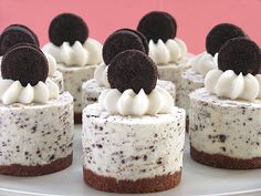 there are many different desserts on the table and one is decorated with oreo cookies