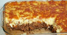 a casserole dish with meat and cheese in it