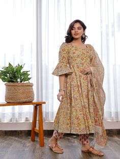 This gorgeous suit set, which includes pants and a chanderi hand block printed chanderi dupatta, is a must-have in your summer wardrobe. It has a flowery round neck hand block printed Anarkali with flared sleeves embellished with Gota. Neck: Boat Neck Sleeve Length: 3/4th Flared Sleeves Kurta Length: Claf Length Fabric: Kurta & Bottom - Cotton Dupatta -Chanderi Note: Wash Care Instructions - Dry Clean Only. The product will be shipped within 15-20 days of the order placed Measurements: Size Bust Anarkali Kurta Set, Cotton Anarkali Kurta, Floral Anarkali, Cotton Anarkali, Anarkali Kurta, Cheap Fabric, Yellow Fabric, Kurta Set, Print Tunic