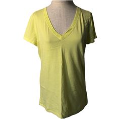 Pastel Neon Yellow V-Neck Short Sleeve Tee. Very Soft. Smoke Free Home. Cross Posted. Approximate Measurements: Chest - 20 Inches Length - 26 Inches Gap V-neck Summer Tops, Yellow Stretch V-neck Top, Casual V-neck Top By Gap, Gap V-neck Tops For Spring, Gap Basic Summer Tops, Green Gap Tops, Neon Yellow, V Neck Tee, Short Sleeve Tee