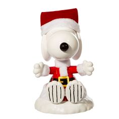 a snoopy christmas ornament with a santa hat