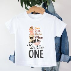 "Farm 1st Birthday Shirt, Cluck Oink Baa Moo I'm One Birthday Shirt, Barnyard Farm Birthday, Barn Animals Matching Family Shirts, Family Tees Introducing the perfect shirt for your one year old little guy - the \"One Happy Dude\" shirt! This shirt is perfect for your little boy's 1st birthday party, and will make him look like the happiest dude in the room. Not only is this shirt adorable, but it also comes in matching birthday shirts for the whole family! The \"One Happy Dude\" family birthday Cute Birthday T-shirt With Cartoon Print, Funny First Birthday T-shirt, Cute Short Sleeve Shirt For First Birthday, Crew Neck Top With Cartoon Print For First Birthday, Cute Cartoon Print Tops For Birthday, Funny First Birthday T-shirt With Letter Print, First Birthday Tops With Cartoon Print And Short Sleeves, Cute Birthday Shirt With Cartoon Print, Playful Crew Neck Top For First Birthday