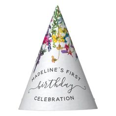 a white party hat with colorful flowers and the words our little wildflowers is turning one