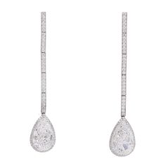 Pear shape drop earrings with the halo. Made in platinum and 18k white gold, set with 142 round brilliant cut diamonds, total weight 0.65 carats color: E-F, clarity: VS, with suspended with two GIA certified diamonds 3.02carat and 3.03 carat Both pear shape diamonds are G.I.A certified D-color and VS2- GIA# XXXXXXX GIA#XXXXXXX NALLY JEWELS White Diamond Jewelry, White Gold Set, Diamond Drop Earrings, Diamond Drops, Pear Shaped Diamond, Antique Earrings, Gia Certified Diamonds, Gold Set, Gia Diamond