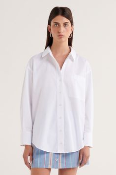 Our Sunday by s t e e l e . collection is a carefully curated range of effortless and easy to wear pieces designed for slow days and everyday use.Elevate your wardrobe with the Sophia Shirt, our s t e e l e . take on the white classic button-up shirt. Crafted from a crisp cotton fabric, this wardrobe essential has been thoughtfully designed in a tailored yet relaxed, oversized style. The s t e e l e . branded buttons are subtle and functional, and the gently scooped hem provides balance to the structure of the collar. Tailored, relaxed shirt Oversized design 100% cotton Subtle scoop hem Functional s t e e l e . branded buttons Functional front pocket with s t e e l e . logo stitching This style is unlined ﻿Sophie is 178cm and wears a size small. Relaxed Everyday Fall Shirt, Relaxed Everyday Shirt For Fall, Relaxed Fall Shirt For Everyday Wear, Classic Oversized Tops For Everyday, Chic Shirttail Hem Shirt For Everyday, Chic Everyday Shirt With Shirttail Hem, Chic Shirt For Daywear With Relaxed Fit, Oversized Effortless Shirt With Shirttail Hem, Classic Oversized Blouse For Everyday