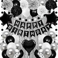 black and white birthday decorations with balloons, pom poms and streamers in the shape of a heart