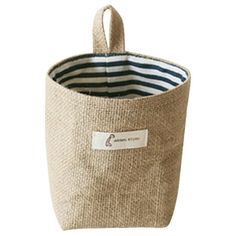 a small storage basket with stripes on it