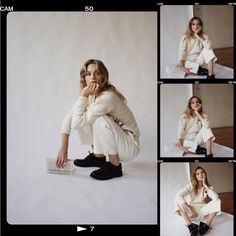 a woman sitting on the ground posing for pictures