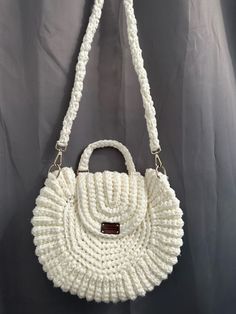 Cream colored crochet handbag with golden hooks for attaching the strap. Lots of space in the bag to store personal belongings. Magnet snap button to close the bag. Unique Width: 38 cm Height : 32 cm Handbag strap: 112 cm long. White Crochet Travel Bag With Top Handle, White Travel Bag With Round Handle, White Crochet Crossbody Bag With Braided Handles, Crochet Tote Bag With Detachable Strap For Travel, Travel Crochet Bag With Detachable Strap, Travel Crochet Tote Bag With Detachable Strap, Travel Crochet Bag With Detachable Strap And Double Handle, Crochet Travel Bag With Detachable Strap And Double Handle, Beige Crochet Bag With Adjustable Top Handle