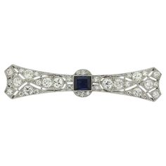 This is an Art Deco sapphire and diamond brooch from the luxury French jewellery designer LaCloche Frères. The brooch is crafted in platinum and the central sapphire is a mid to dark blue hue. The darker tone of the sapphire emphasises the bright white sparkle of the perfectly matched old cut diamonds. This brooch is as wearable today as it would have been 100 years ago. LaCloche is synonymous with some of the most exciting jewellery of the early 20th Century. The firm closed its doors in 1931, Lacloche Freres, French Jewelry, 100 Years Ago, Jewellery Designer, Diamond Brooch, Blue Hues, Early 20th Century, 100 Years, Bright White