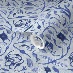 a blue and white wallpaper with an animal pattern on it's surface,