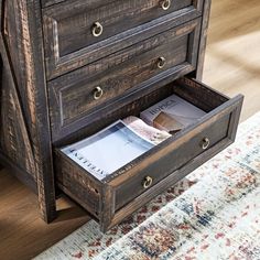 the drawers are open on top of the dresser