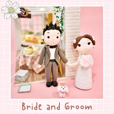 a bride and groom figurine standing next to each other in front of a pink background