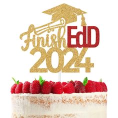 a cake that has some strawberries on it and a graduation cap on the top