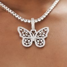 Introducing the Large Iced Butterfly Pendant, an eye-catching piece that sure to make a statement! Its stunning details give it a unique look that will stand out from any other piece in your collection. Crafted in 14k White Gold, the butterfly features hand-set stones and wings filled with our signature GLD stars for extra detail and shine. Pair it with the Iced Butterfly Diamond Prong Cuban Necklace- 6mm for the perfect set. This product is guaranteed for life - GLD will repair the item should Iced Out Metal Pendant Jewelry, Fine Jewelry White Rhinestone Jewelry, White Fine Jewelry With Rhinestones, Fine White Jewelry With Rhinestones, White Vvs Clarity Jewelry For Party, Luxury Butterfly Shape White Gold Jewelry, Luxury Butterfly Shaped White Gold Jewelry, Luxury White Gold Butterfly Jewelry, Luxury Butterfly White Gold Jewelry