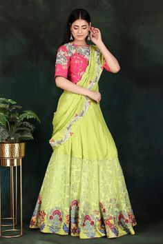 Parrot green lehenga saree with floral and thread hand embroidered pallu. Comes with a magenta padded blouse and a petticoat with an attached cancan. - Aza Fashions Semi-stitched Green Choli For Eid, Semi-stitched Green Lehenga With Dupatta, Green Semi-stitched Lehenga With Dupatta, Semi-stitched Pista Green Choli For Eid, Green Art Silk Lehenga With Zari Work, Green Bollywood Choli In Dola Silk, Semi-stitched Green Choli For Navratri, Green Art Silk Lehenga For Festive Occasions, Bollywood Style Green Art Silk Lehenga