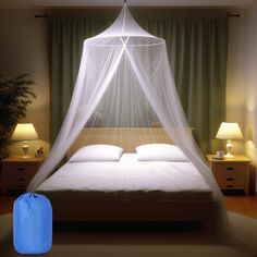 a bed with a white mosquito net over it