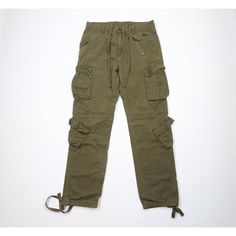 Vintage 90s Streetwear Mens 32x32 Faded Tactical Military Cargo Pants Army Green Mens Pants Hole front top near fly. Color faded Mens size 32 (no tag, check measurements) Measurements are: 16 inches across the waist laid flat 32 inch inseam 42 inches from top to bottom 7.5 inch leg open Green Cotton US Shipping is FREE, Canada is $15 and International is $24 Check out my other items in my store! PR2233 Cotton Combat Cargo Jeans With Straight Leg, Military Style Straight Leg Parachute Pants For Streetwear, Combat Style Cotton Parachute Pants With Straight Leg, Cotton Combat Parachute Pants With Straight Leg, Military Style Full-length Cargo Jeans For Streetwear, Combat Style Cotton Parachute Pants, Khaki Full Length Cargo Jeans For Streetwear, Full Length Khaki Cargo Jeans For Streetwear, Combat Style Cotton Cargo Jeans With Belt Loops