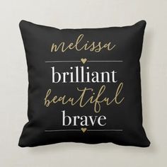 a black and gold pillow with the words, nessess brilliant beautiful brave on it