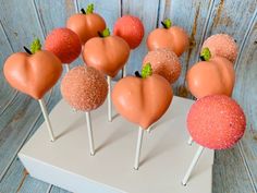 there are many candy apples on the stick