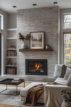 a living room filled with furniture and a fire place in the middle of a wall