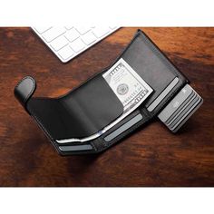 A small, yet highly practical wallet. It will store the essentials without taking up much space.  Made of fine, exclusive Italia leather. Cards, banknotes - you always have them close at hand, organised in several easily accessible pockets. A gradual card ejecting "pulse" mechanism ensures easy and quick access to the wallet's contents. Thanks to the Rfid blocking technology used in the wallet design, your sensitive data and credit card funds are completely safe and protected from unauthorised reading or theft.  Registered design - unique and original! Ideal for minimalists and all those for whom less is more. Dry clean only. Made in Poland. Functional Bifold Wallet With Rfid Blocking, Functional Trifold Wallets With Card Slots, Modern Trifold Wallet With Rfid Blocking For Everyday, Functional Leather Trifold Wallet With Card Slots, Functional Leather Wallet With Card Slots, Functional Wallets With Card Slots For Everyday, Functional Everyday Wallet With Card Slots, Wallet Aesthetic, Smart Glass