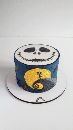 a halloween cake with jack skellingy face on it