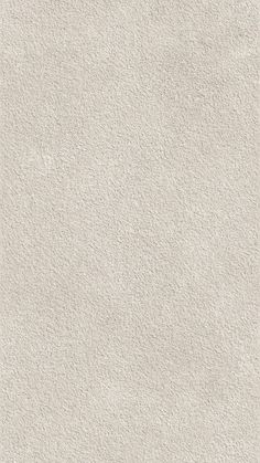 an image of a white textured wallpaper with no lines or dots on it