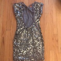 Silver Sequin Mini Dress Never Worn. No Tags But Fits Like An Xxs/Xs. Sexy And Fun. Tie At The Back Open Back Lined Inside With A Soft T-Shirt Feel Nwot Flirty Fitted Backless Sequin Dress, Fitted Sequin Mini Dress For Going Out, Sequined Mini Dress For Going Out Party Season, Sequined Mini Bodycon Dress For Going Out, Sequin Mini Length Bodycon Dress For Going Out, Fitted Sequin Dress, Fitted Sequin Dress For Night Out, Silver Sequin Mini Dress, Fun Tie