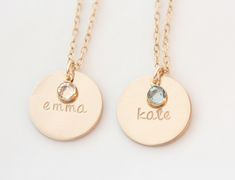 "This listing features 1-3 medium 5/8\" 14K gold filled discs hand stamped with a name. Attached to the disc is a faceted swarovski birthstone to represent your little ones birth month. Suspended from a 14K Gold filled cable chain as shown. Also available in sterling silver here: https://www.etsy.com/listing/475806906/personalized-birthstone-necklace-name?ref=shop_home_active_11&frs=1" Gold Birthstone Necklace With Name On Round Pendant, Personalized Round Gold Birthstone Necklace, Personalized Name Charm Necklaces, Gold Hand Stamped Necklace For Birthday, Gold Hand Stamped Necklace For Birthday Gift, Gold Birthstone Necklace, Necklace Emerald, Emerald Birthstone, Gold Name Necklace