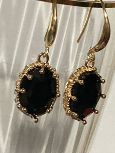 18k gold plated black glass crystal diamanté ornate deep set oval crystal cabochon drop charm earrings  many others colours in the range  The earwires are nickel free,18k gold rhodium plated on a copper base metal Elegant Metal Jewelry With Oval Pendant, Oval Cabochon Earrings For Evening, Elegant Metal Oval Pendant Jewelry, Elegant Nickel-free Oval Pendant Jewelry, Elegant Nickel-free Oval Pendant Earrings, Elegant Cabochon Jewelry For Parties, Elegant Oval Jewelry With French Hook, Oval Jewelry With French Hook For Gifts, Oval Cabochon Jewelry For Party