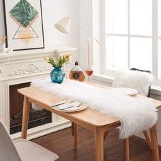 a dining room table with white fur on it