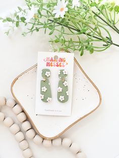 Clay Earrings. Sage Green Earrings with tiny creme Daisys. Gold Findings approx 1.5 inches long Sage Green Earrings, Earrings Making, Daisy Earrings, Earrings Green, Green Earrings, Floral Earrings, Light Weight Earrings, Clay Jewelry, Clay Earrings