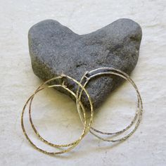 "Sterling Silver Hoop Earrings~ Simple yet elegant sterling silver threader hoops, hammered and polished for that extra sparkle. Choose the size hoops you would like from the drop down menu 1\" 1.5\" Also available in 14k gold fill~ https://www.etsy.com/listing/810213511/gold-hoop-earrings-threader-hammered?ref=shop_home_active_1&frs=1 *Models wearing similar design Shop~ http://www.etsy.com/shop/HanaMauiCreations?ref=pr_shop_more International buyers please read our shipping policies before Dainty Hammered Hoop Earrings, Dainty Hammered Round Hoop Earrings, Silver Dainty Hammered Hoop Earrings, Dainty Hammered Silver Hoop Earrings, Hammered Hoop Earrings For Gift, Dainty Small Hoop Hammered Jewelry, Hammered Hoop Earrings Gift, Hammered Hoop Earrings As Gift, Gift Hammered Hoop Earrings