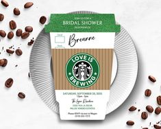 a paper plate with a starbucks coffee bag on it next to some roasted coffee beans