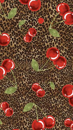 a leopard print with red roses and green leaves on the top, in front of an animal print background