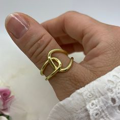 "**Elevate Your Style with Our 18K Gold Plated Capital Great Knot Thumb Ring 🌟 **Unique and Bold Design This 18K gold plated Capital Great Knot Thumb Ring is a true statement piece, combining unique design with boldness. Its intricate knot detail and chunky signet style make it a versatile accessory to enhance your everyday look. 💍 **Adjustable for Comfort Crafted for convenience, this dainty weaved thick adjustable ring ensures a perfect fit on any finger, including the thumb. Its adaptability allows you to wear it with ease, expressing your style effortlessly. 🎁 **Ideal Christmas Gift Whether you're searching for a Christmas present or a special gift for her, this Capital Great Knot Thumb Ring is an excellent choice. Its craftsmanship and charm will make her holiday season extra speci Trendy Gold Promise Ring, Trendy Gold Rings For Gift, Trendy Gold Rings Perfect For Gifts, Trendy Gold Rings For Gifts, Gold Metal Midi Rings For Anniversary, Trendy Gold Rings For Anniversary, Trendy Gold-plated Gold Midi Rings, Trendy Gold Midi Rings As Gift, Trendy Gold Midi Rings For Gifts