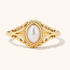 Indulge in a touch of vintage charm with our elegant Vintage Pearl Ring. Crafted with exquisite detailing, this ring features a lustrous pearl set in a classic design. This ring is perfect for those who love timeless and sophisticated pieces, making it a versatile addition to your jewelry collection Pearl Rings Vintage Sales, Classic Pearl White Ring For Promise, Timeless Pearl Drop Rings, Elegant Open Ring With Pearl Charm, Elegant Open Pearl Ring, Classic Pearl White Rings With Pearl Drop, Elegant Pearl Ring With Pearl Charm For Weddings, Elegant Signet Ring With Classic Design For Anniversary, Elegant Yellow Gold Signet Ring