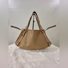 This Shoulder Bag Features A Canvas Body With Leather Trim, Flat Leather Straps, An Open Top, And Interior Zip And Slip Pockets. This Gucci Item Is 100% Authentic And All Purchases Over $500 Will Be Authenticated By Poshmark I Also Have Entrupy Device And Will Be Happy To Include A Certificate If The Order Is Under $500 And Not Going To Poshmark. Gold Monogram Canvas Shoulder Bag With Double Handle, Gold Monogram Canvas Shoulder Bag For Shopping, Gold Monogram Canvas Shoulder Bag With Handles, Gold Monogram Canvas Satchel Shoulder Bag, Gold Monogram Canvas Shoulder Bag For Daily Use, Chic Gold Monogram Canvas Shoulder Bag, Open Top, Leather Trim, Womens Tote Bags