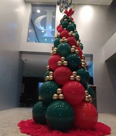 a christmas tree made out of balloons and ornaments