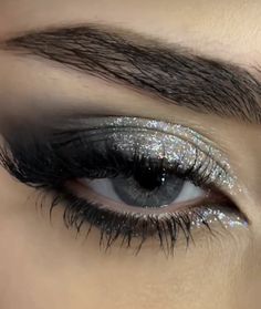 Black Eyeshadow Looks With Glitter, Siren Eyes Eyeshadow, Smokey Eyeliner With Glitter, Smokey Eye Makeup For Blue Green Eyes, Black Sparkly Eyeshadow, Grey And Silver Eyeshadow, Black And Silver Makeup Ideas, Silver Glitter Eyeliner Looks, Star Glitter Eye Makeup