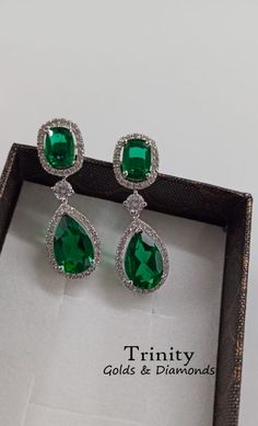 Emerald Dangle Earrings/ 14K Finish Emerald And Diamond Dangle Earring/ 925 Silver Diamond Dangle Earrings/ Wedding Bridal Earrings/ Gifts !~ Main Stone : Main Stone : Emerald Main Stone Creation: Lab created Diamonds Color :Green Cut:Pear/Oval !~ Secondary Stones Specifications : Moissanite Color - Near White or Cubic Zirconia - White > Stone Shape: Round Brilliant cut > Main Stone Clarity: VVS1 > Stone Color : Near White > Cut Grade: Excellent !~ Metal : > Metal Type: 100% 925 Sterling Silver Pear Shaped Emerald Earrings, Formal Emerald Drop Jewelry, Formal Drop Emerald Jewelry, Green Fine Jewelry Cluster Earrings For Formal Events, Green Pear-shaped Earrings For Formal Events, Green Teardrop Diamond Earrings For Anniversary, Green Diamond Earrings For Formal Occasions, White Gold Long Drop Earrings For Anniversary, Fine Jewelry Green Drop Earrings