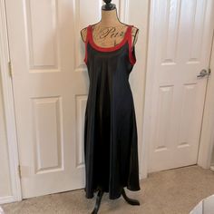 Bloom Branded Long Black Satin Nightie/Nightgown Or Slip That Is Sleeveless With Red Detailed Satin Neck Scoop & Straps! Length Is 49” Long, And 21“ Armpit To Armpit. Soft Silky And Luxurious! Never Worn, No Flaws, No Stains. Tried On One Time, Too Big For Me Went Low On Bust Scoop Neckline. Needs A Bigger Busted Person To Wear It. Nonsmoking Home. Nice And Cool To Wear For Hot Climates! Thick Polyester Satin Material! Sleeveless Nightgown For Night Out, Sleeveless Satin Sleepwear For Night Out, Sleeveless Bias Cut Slip Dress For Loungewear, Sleeveless Slip Dress Bias Cut For Loungewear, Black Sleeveless Sleepwear, Elegant Sleeveless Red Nightgown, Red Sleeveless Satin Nightgown, Sleeveless Satin Nightgown, Sleeveless Bias Cut Nightgown