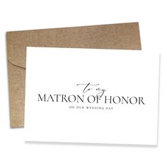 a white card with the words matron of honor on it and a brown envelope